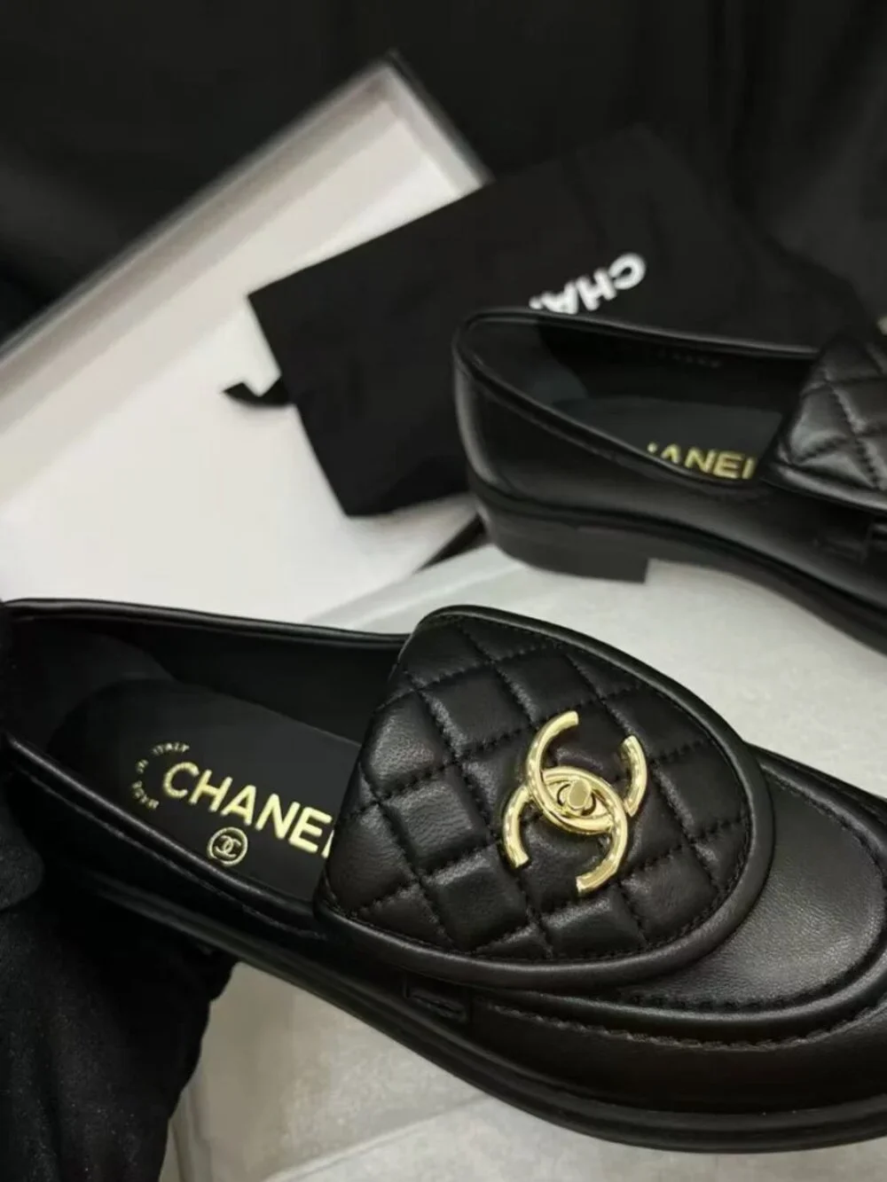 CHANEL black flap‑design loafers